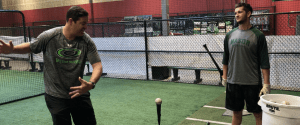 Jake Epstein hitting instructor with college player