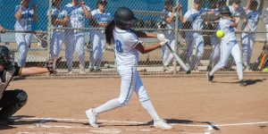 fast pitch softball hitter at contact